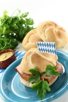 a roll with meatloaf and parsley