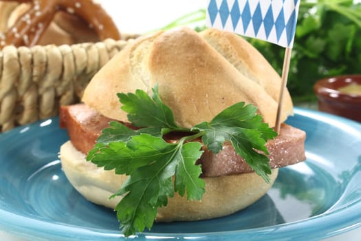 a roll with meatloaf and parsley