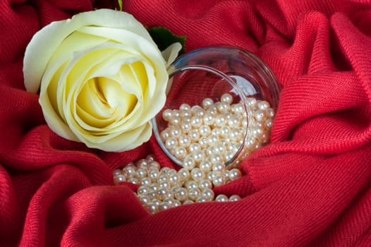 pearls scattered on a colored background fabric