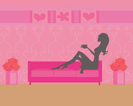 girl on coffee break on the sofa