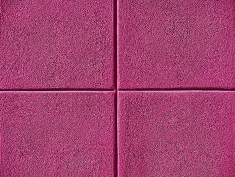 Four pink squares on a concrete wall, powerpoint background and copy space.