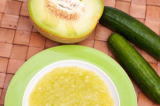 Cold soup in a plate with fruits and vegetables