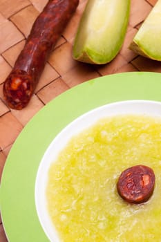 Paprika and pork sausage and melon soup