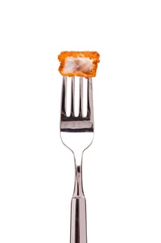 White fried fish fingers on a fork