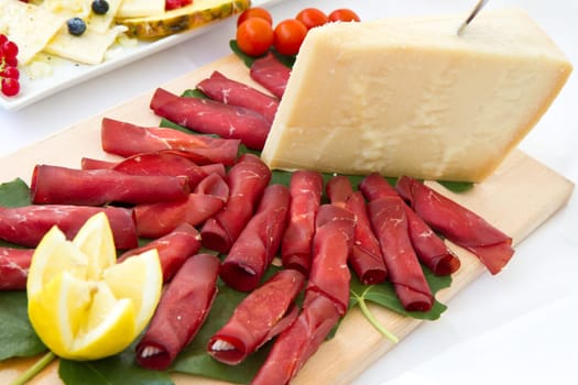 Italian appetizer with bresaola and parmesan cheese