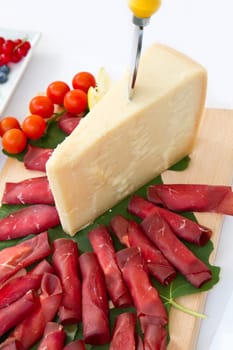 Italian appetizer with bresaola and parmesan cheese