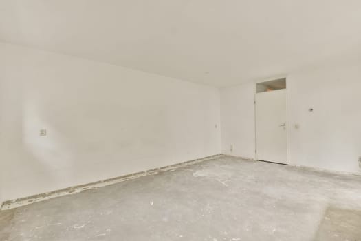 an empty room with white walls and no one door on the other wall in it is being used for storage