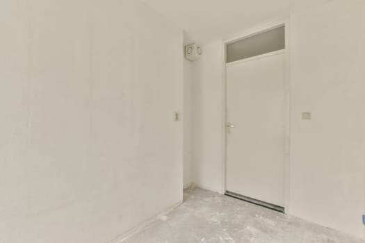 an empty room with white walls and no one person in the room, or someone standing on the other wall