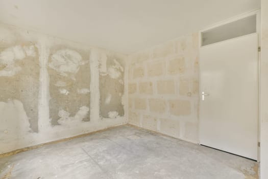 an unfinished room with white walls and dry plaster on the wall is in need of repair, but it's not finished