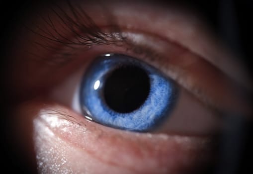 Closeup of beautiful bright blue human eye. Vision correction concept