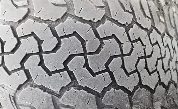 Winter tires on car wheel with frost closeup. Changing winter tires for summer concept