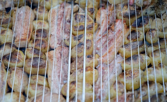 Grill potatoes and meat on wire rack. Cooking food on coals concept