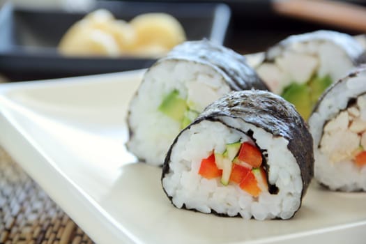 Delicious freshly rolled hicken sushi ready to serve.