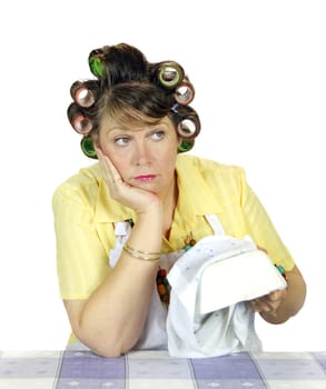 Bored and apathetic housewife sick of wiping the dishes.