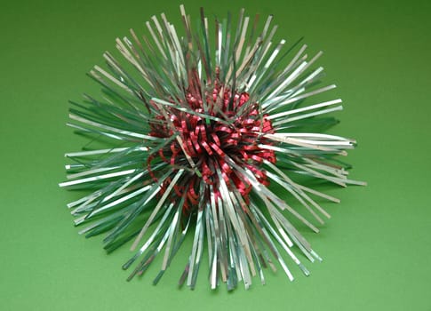 Star-shaped christmas decoration on green background