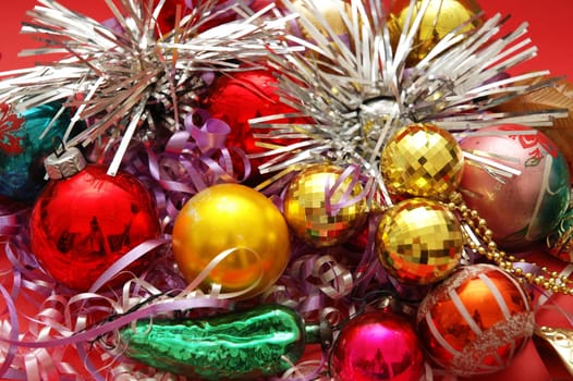 Various Christmas decorations on the red background