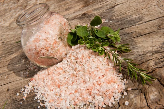 bottle of Himalayan salt on a wooden board