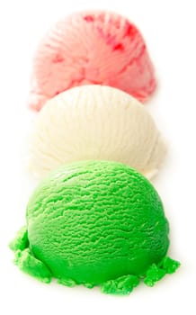 Close up shot of green, white, and red ice cream ball on white background - Italian ice cream concept