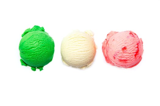 Variety of Italian icecreams with individual scoops of three different flavourings in green , pink and white lined up in a row isolated on white