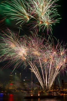 Fireworks Display Along Willamette River with Portland Oregon Skyline at Night