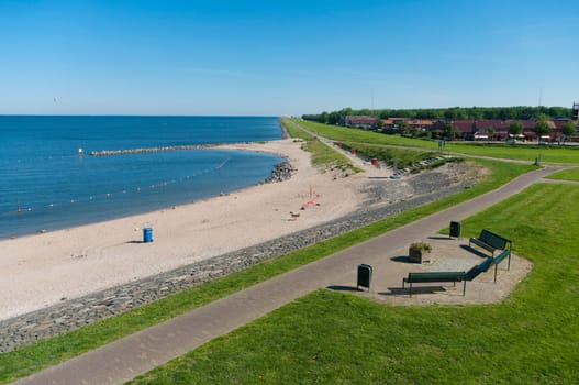 view over a small beach along the IJsselmeer in the Netherlands
