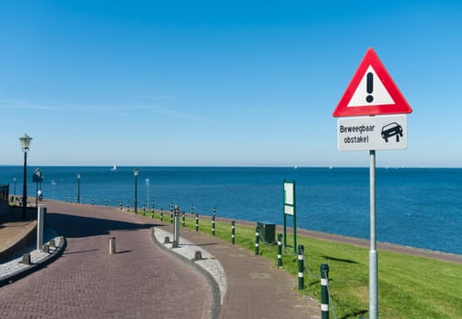 traffic sign warning for a movable obstacle in the road