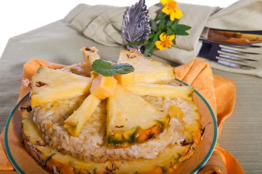 Rice pudding with pineapple on a green background