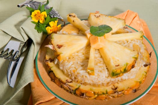 Rice pudding with pineapple on a green background
