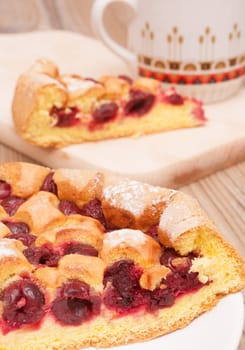 Homemade Cherry Pie and Mug on Wooden Table