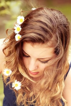 Portrait of a beautiful 20 year old woman enjoying a summer day outdoor.