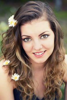 Portrait of a beautiful 20 year old woman enjoying a summer day outdoor.