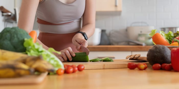 Young Asian healthy beautiful woman with casual clothes is smile and slicing fresh fruit to diet at home in kitchen in holiday.