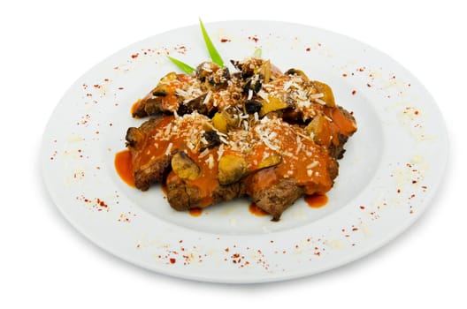 Meat under tasty sauce in plate