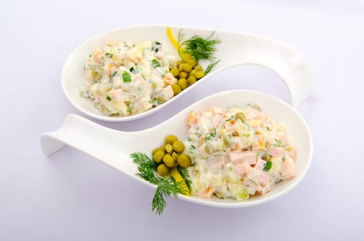Riussian salad served in the plate