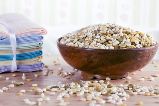 Bowl of healthy mixure of barley and greena and yellow lentils.