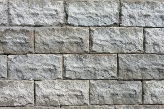 white roughly textured brick wall painted with white paint