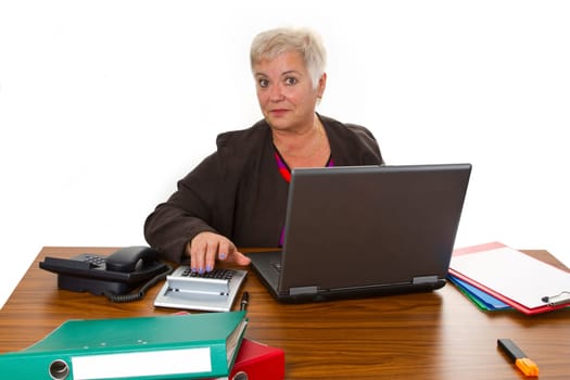 Senior woman at work - isolated on white background