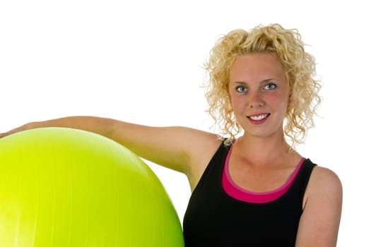 Young woman with exercise ball isolated on white background