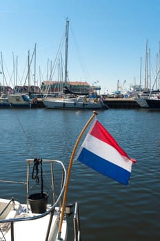 dutch flag on a sailboat in the harbor of Urk, Netherlands