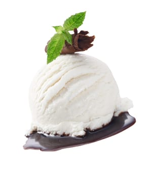 Scoop of creamy vanilla icecream served with chocolate sauce and garnished with a rolled shaving of milk chocolate and mint leaves