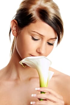 Beautiful young girl with flower against white background