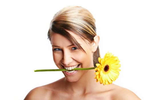 Beautiful young girl with flower against white background