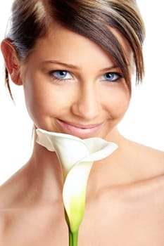 Beautiful young girl with flower against white background