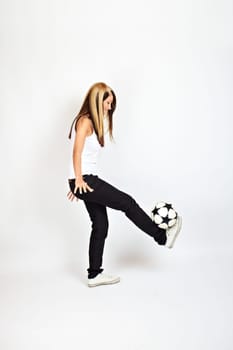 blonde woman playing football