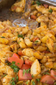 Provencal potatoes ready for sale. Fast food.