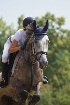 TRESTINA - JULY 07: Unidentified rider in action at "Jump equestrian Moravian Championship"" on July 07, 2012 in Trestina (Czech Republic)"