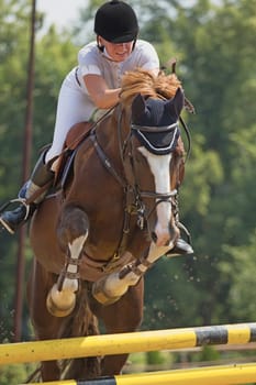 TRESTINA - JULY 07: Unidentified rider in action at "Jump equestrian Moravian Championship"" on July 07, 2012 in Trestina (Czech Republic)"