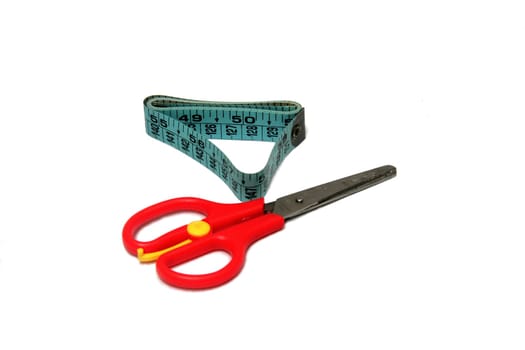 Measuring tape and scissors used in tailoring work
