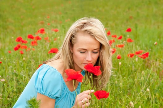 Young woman with poppy