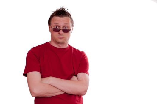 Man in red t-shirt and sunglasses looking surprised and skeptical